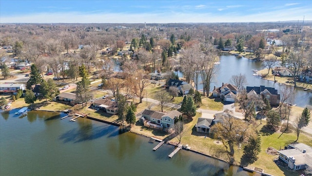 birds eye view of property featuring a residential view and a water view