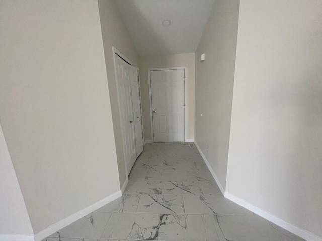 46132 Royal Dr, Chesterfield, MI 48051 - hall featuring baseboards, lofted ceiling, and marble finish floor