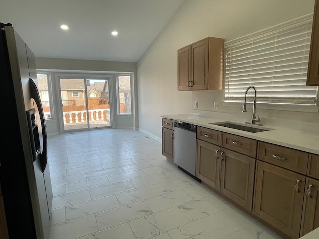 46132 Royal Dr, Chesterfield, MI 48051 - kitchen featuring lofted ceiling, recessed lighting, light countertops, a sink, and stainless steel appliances