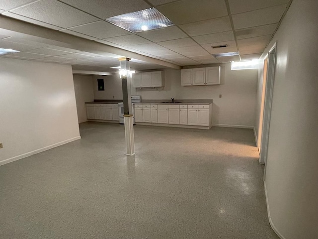 46132 Royal Dr, Chesterfield, MI 48051 - finished basement featuring baseboards, a sink, a paneled ceiling, and visible vents