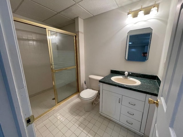 46132 Royal Dr, Chesterfield, MI 48051 - bathroom with vanity, toilet, tile patterned floors, a paneled ceiling, and a stall shower