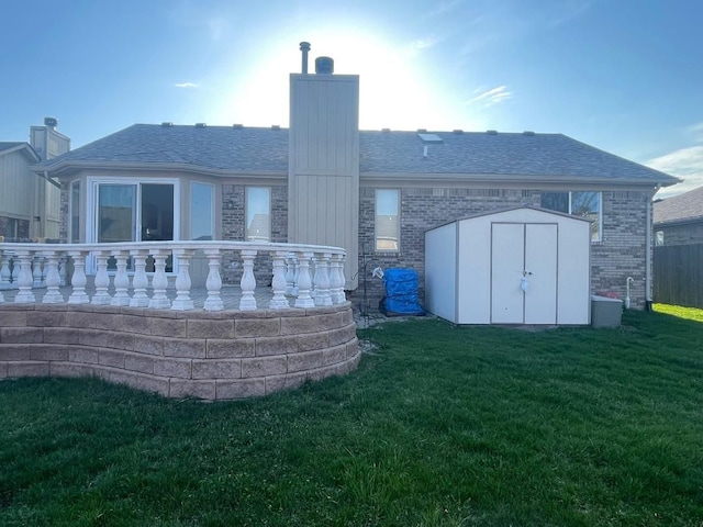 46132 Royal Dr, Chesterfield, MI 48051 - rear view of property featuring an outdoor structure, a yard, a chimney, and a shed