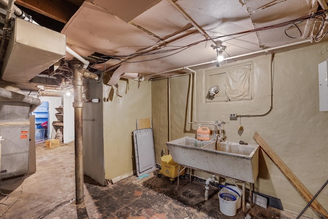 unfinished below grade area with heating unit and a sink