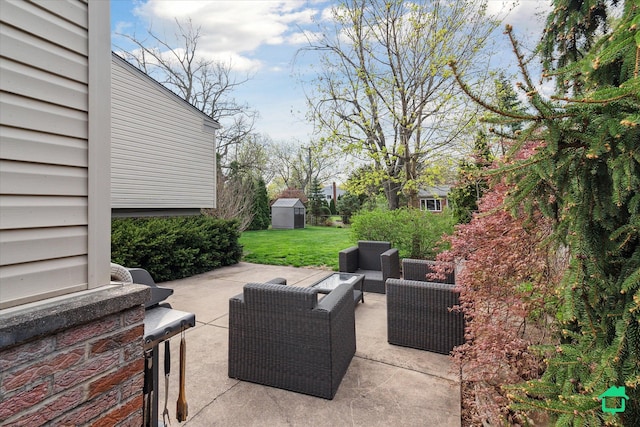 view of patio featuring a storage shed, outdoor lounge area, and an outbuilding