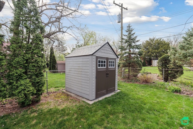 view of shed with a fenced backyard