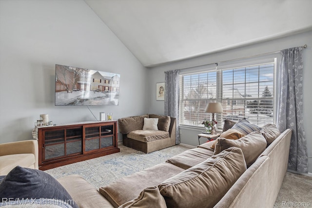 3380 Kneeland Cir, Howell, MI 48843 - living room featuring carpet floors, high vaulted ceiling, and baseboards