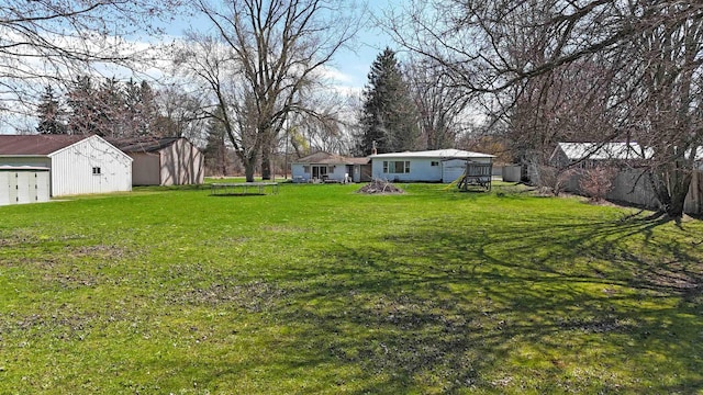 2086 Sloan Rd, Burt, MI 48417 - view of yard with an outdoor structure