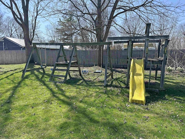 2086 Sloan Rd, Burt, MI 48417 - view of yard featuring a playground and a fenced backyard