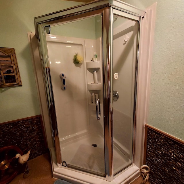 full bath featuring a shower stall