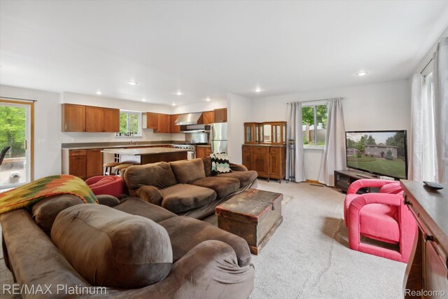 11520 Weiman Dr, Pinckney, MI 48169 - living room featuring light colored carpet and recessed lighting