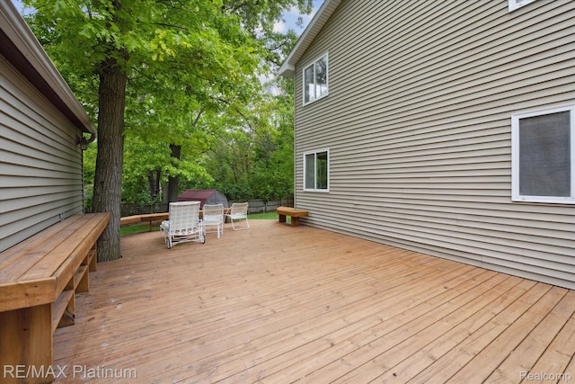 11520 Weiman Dr, Pinckney, MI 48169 - wooden terrace featuring outdoor dining space, a fenced backyard, and grilling area