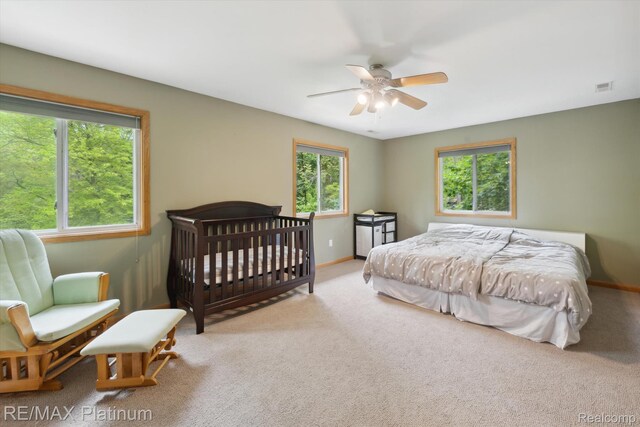 11520 Weiman Dr, Pinckney, MI 48169 - carpeted bedroom with baseboards and ceiling fan