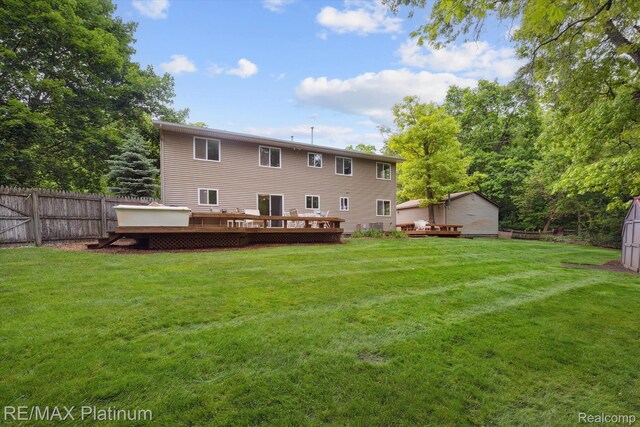 11520 Weiman Dr, Pinckney, MI 48169 - back of house with a deck and an outbuilding