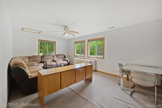 11520 Weiman Dr, Pinckney, MI 48169 - living area with a ceiling fan, light colored carpet, and baseboards