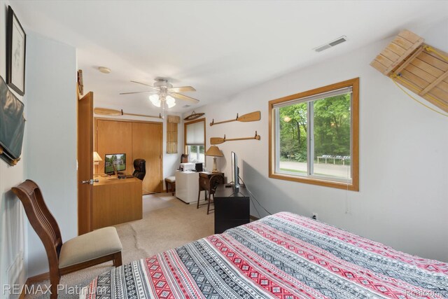 11520 Weiman Dr, Pinckney, MI 48169 - bedroom featuring carpet flooring, ceiling fan, and an office area