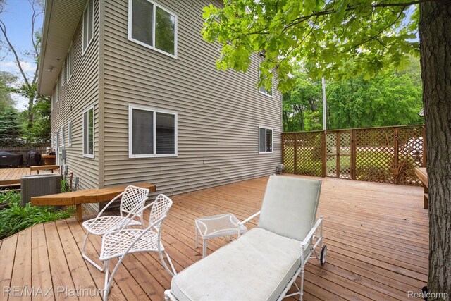 11520 Weiman Dr, Pinckney, MI 48169 - deck featuring central air condition unit
