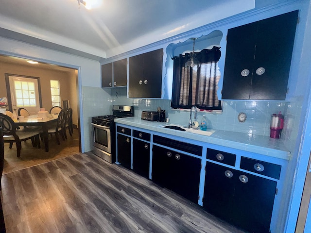 17314 Veronica Ave, Eastpointe, MI 48021 - kitchen with a sink, backsplash, dark wood-type flooring, and stainless steel range with gas stovetop