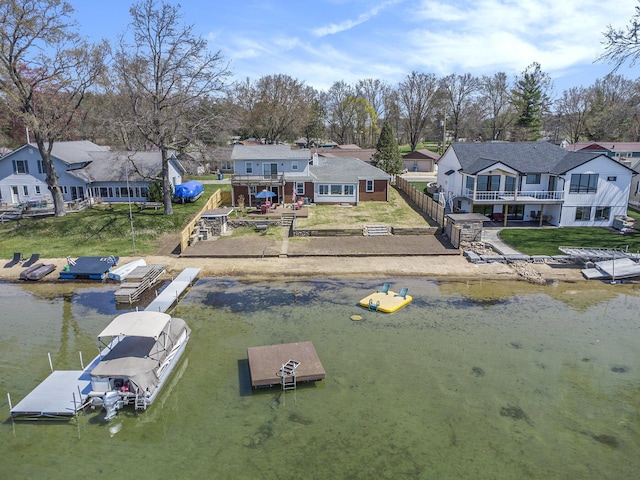 bird's eye view featuring a residential view and a water view
