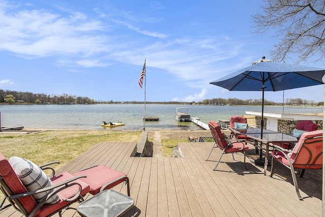 exterior space with a boat dock and a water view