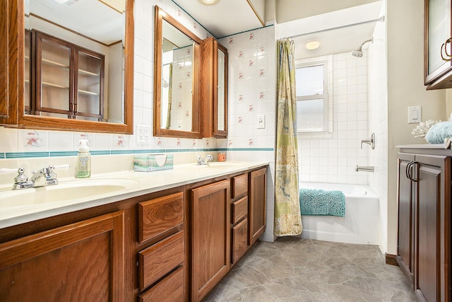 full bath featuring shower / bath combination with curtain, a sink, and double vanity