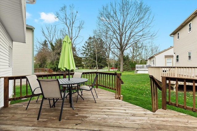 514 Mill Pond Dr, Fenton, MI 48430 - wooden terrace featuring outdoor dining space and a yard
