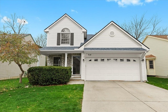 514 Mill Pond Dr, Fenton, MI 48430 - traditional-style home featuring covered porch, a garage, driveway, roof with shingles, and a front yard