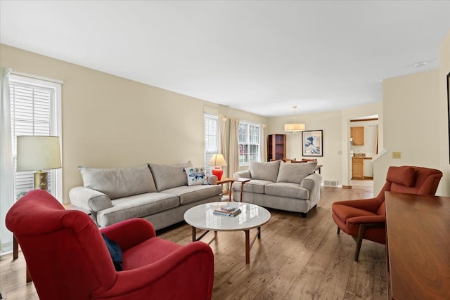 514 Mill Pond Dr, Fenton, MI 48430 - living area with visible vents and light wood-style flooring