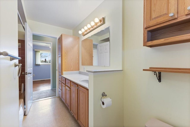 bathroom featuring toilet, vanity, and tile patterned floors