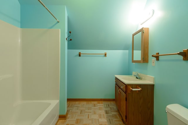 bathroom with toilet, bathing tub / shower combination, and vanity