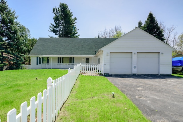 ranch-style home featuring a porch, roof with shingles, fence, a front lawn, and an attached garage