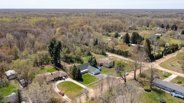 aerial view featuring a wooded view