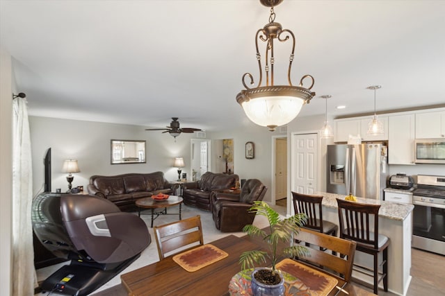 dining space with recessed lighting and ceiling fan