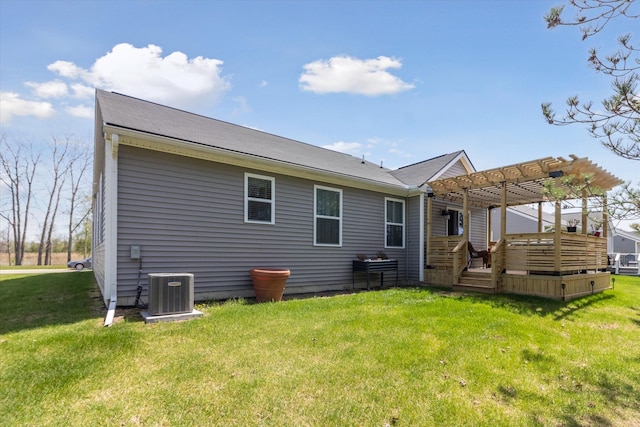 back of house featuring a lawn, central AC, a pergola, and a wooden deck