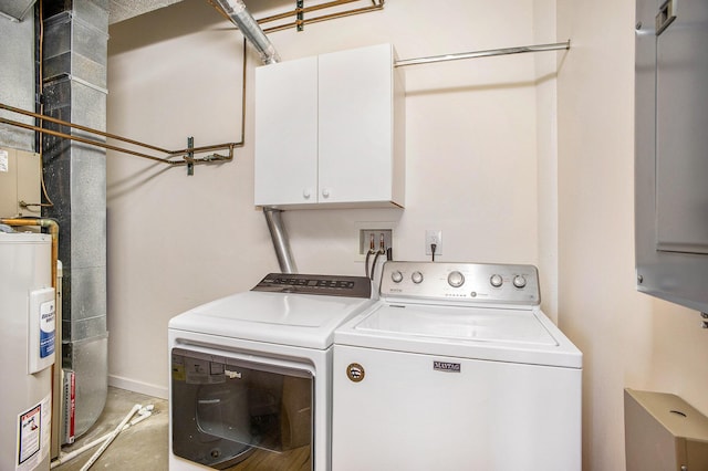 clothes washing area featuring cabinet space, water heater, and independent washer and dryer