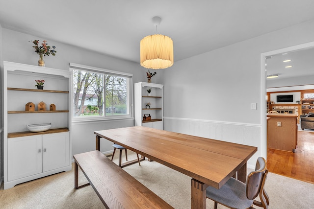 dining room featuring recessed lighting and light carpet