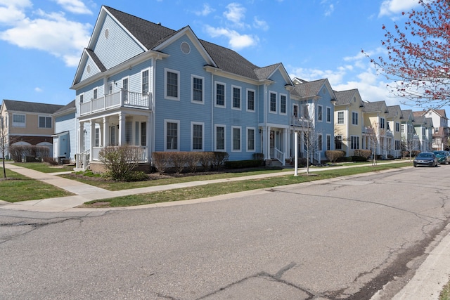 view of street with curbs, sidewalks, and a residential view