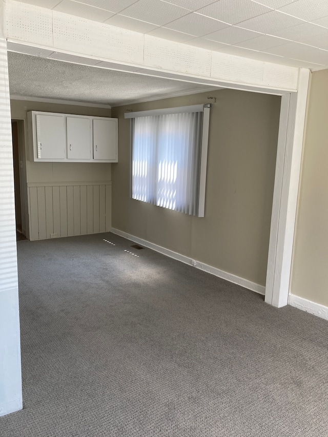 empty room with baseboards and carpet floors