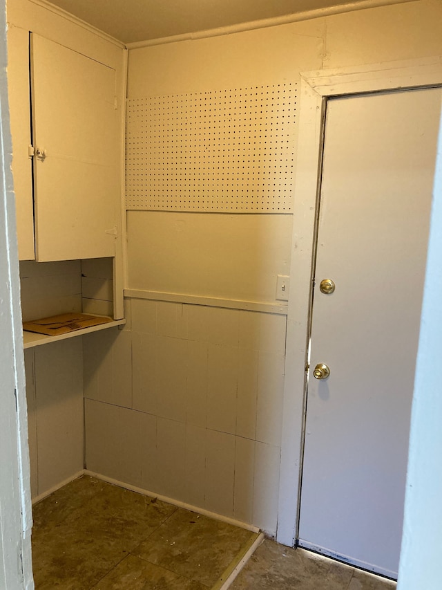 interior space featuring concrete block wall