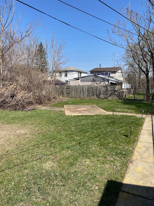 view of yard featuring fence and a patio area