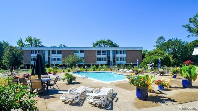 pool featuring a patio and fence