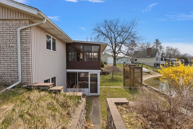 exterior space featuring a sunroom