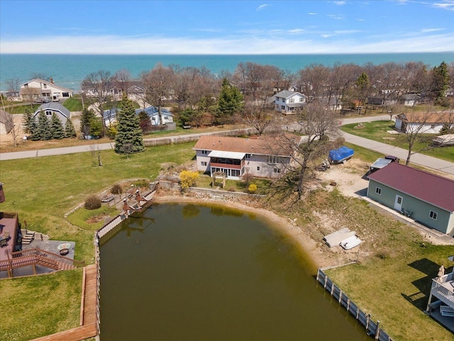 drone / aerial view with a water view