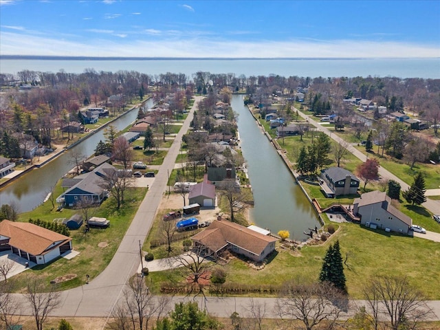 drone / aerial view with a residential view and a water view
