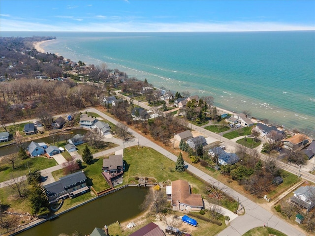 aerial view with a water view and a residential view