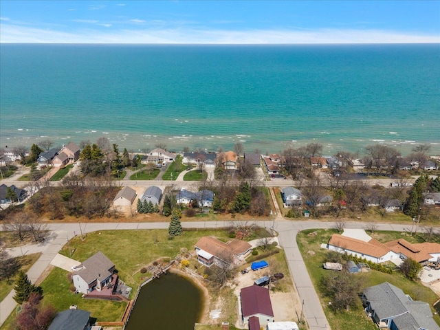 aerial view featuring a residential view and a water view