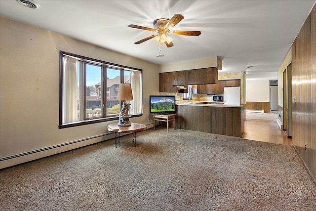 interior space with light carpet, a ceiling fan, and visible vents
