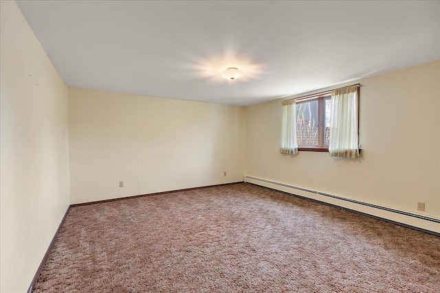 carpeted spare room featuring baseboards and a baseboard heating unit