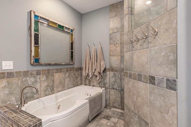 full bath with a tub with jets