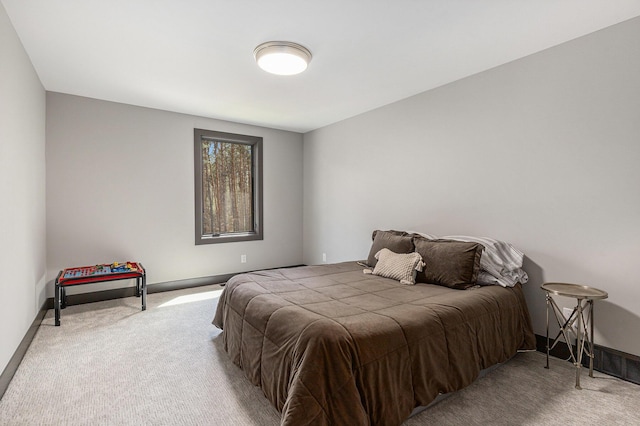 carpeted bedroom with baseboards