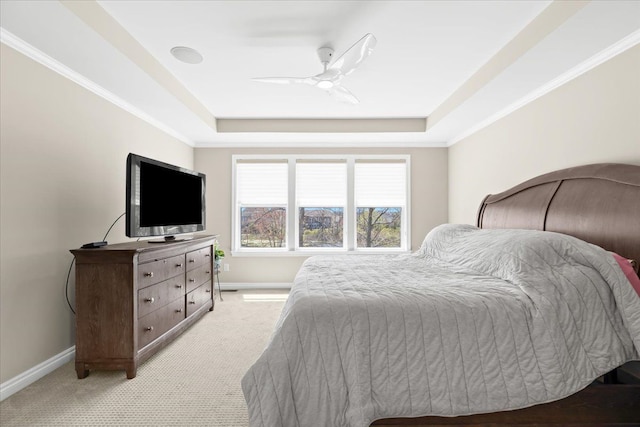 bedroom featuring baseboards, a ceiling fan, a raised ceiling, and light colored carpet